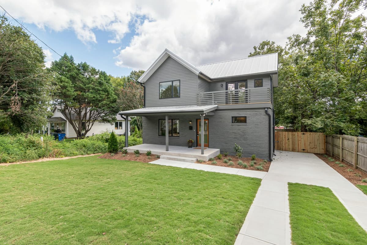 Well-maintained modern home with a manicured front lawn